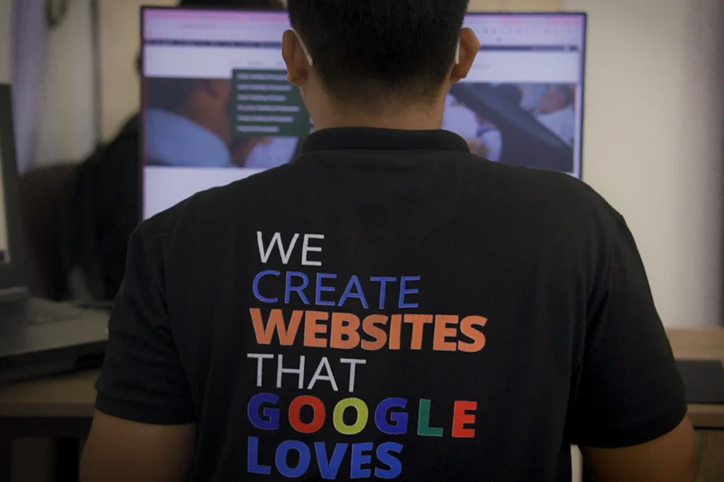 A team member working on a website development project at a computer workstation.